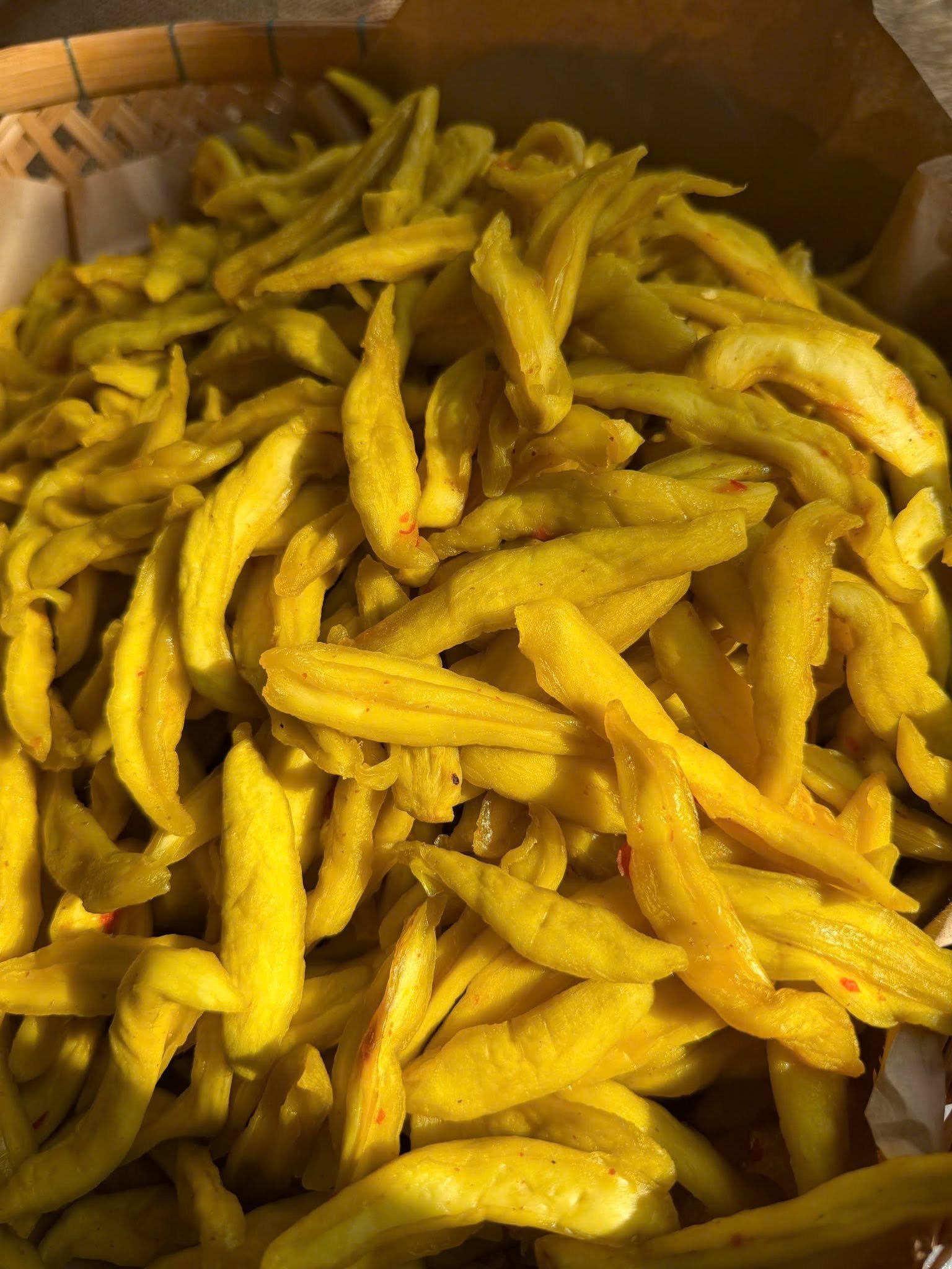 Close-up of chewy Vietnamese Green Mango Chili Salt Snack with tangy chili seasoning