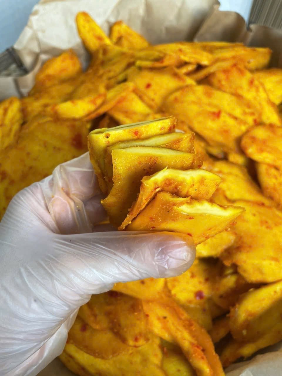 Close-up of chewy Vietnamese Soft Dried Mango with Chili Salt showing its soft texture and chili seasoning