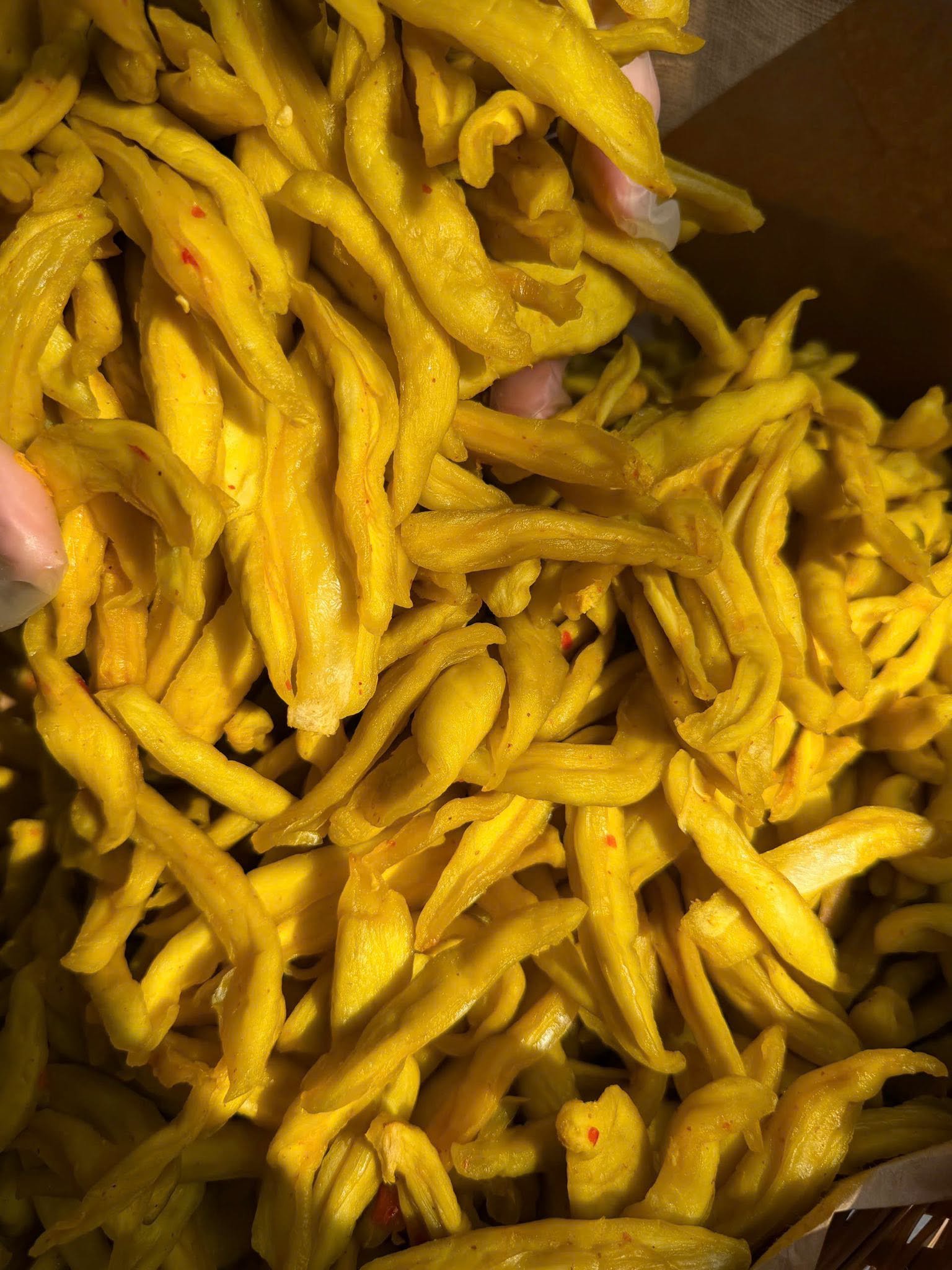 Close-up of chewy Vietnamese Green Mango Chili Salt Snack with tangy chili seasoning