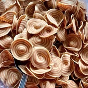 Close-up of Vietnamese Giant Coconut Palm Cookies with crispy spiral layers and rich coconut flavor
