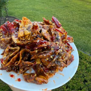 Close-up of Vietnamese Tamarind Glazed Dried Squid showing tender chewy texture and glossy tamarind glaze