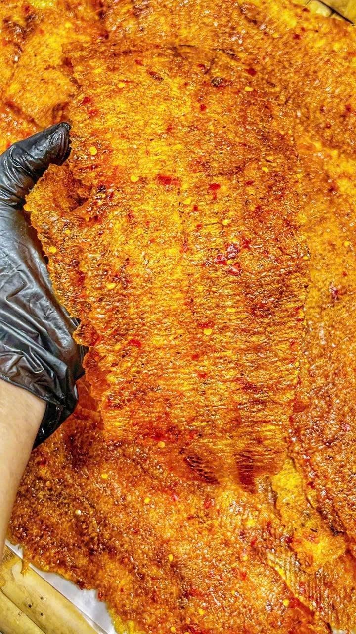 Close-up of Dried Squid with Kumquat Sauce featuring chewy pressed squid